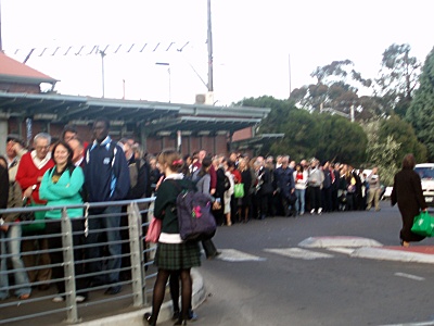 Rail commuters waiting for replacement bus services.